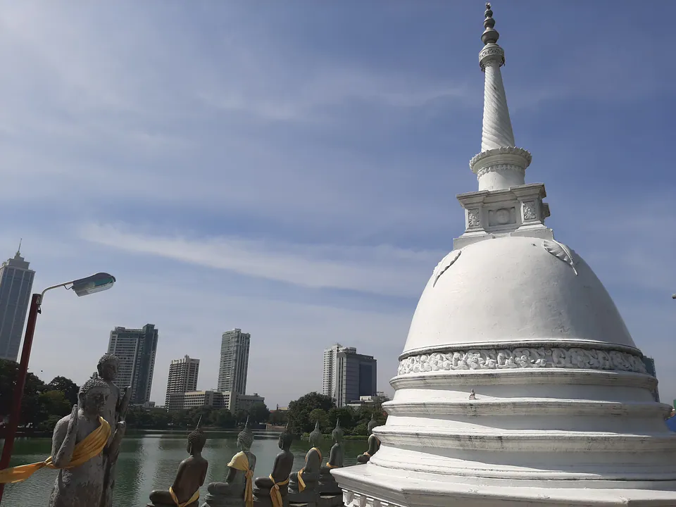 The white dagoba of Seema Malaka on Beira Lake, with the Colombo skyline behind